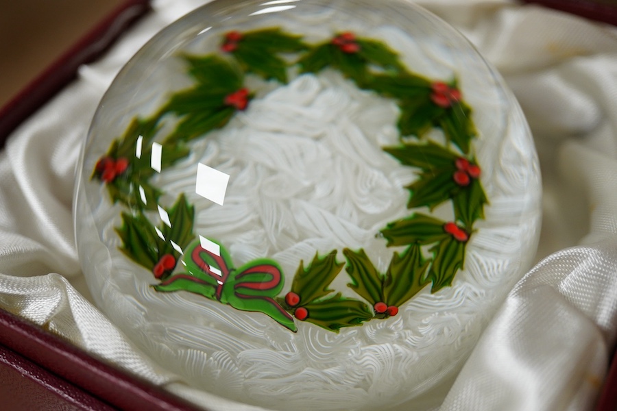 Two Perthshire glass Christmas paperweights for 1981 and 1983, a Perthshire miniature Latticino weight, 18/400, dated 1982, and a Selkirk glass Millefiori crown paperweight, 1982, (4) Largest Perthshire paperweight 8cm